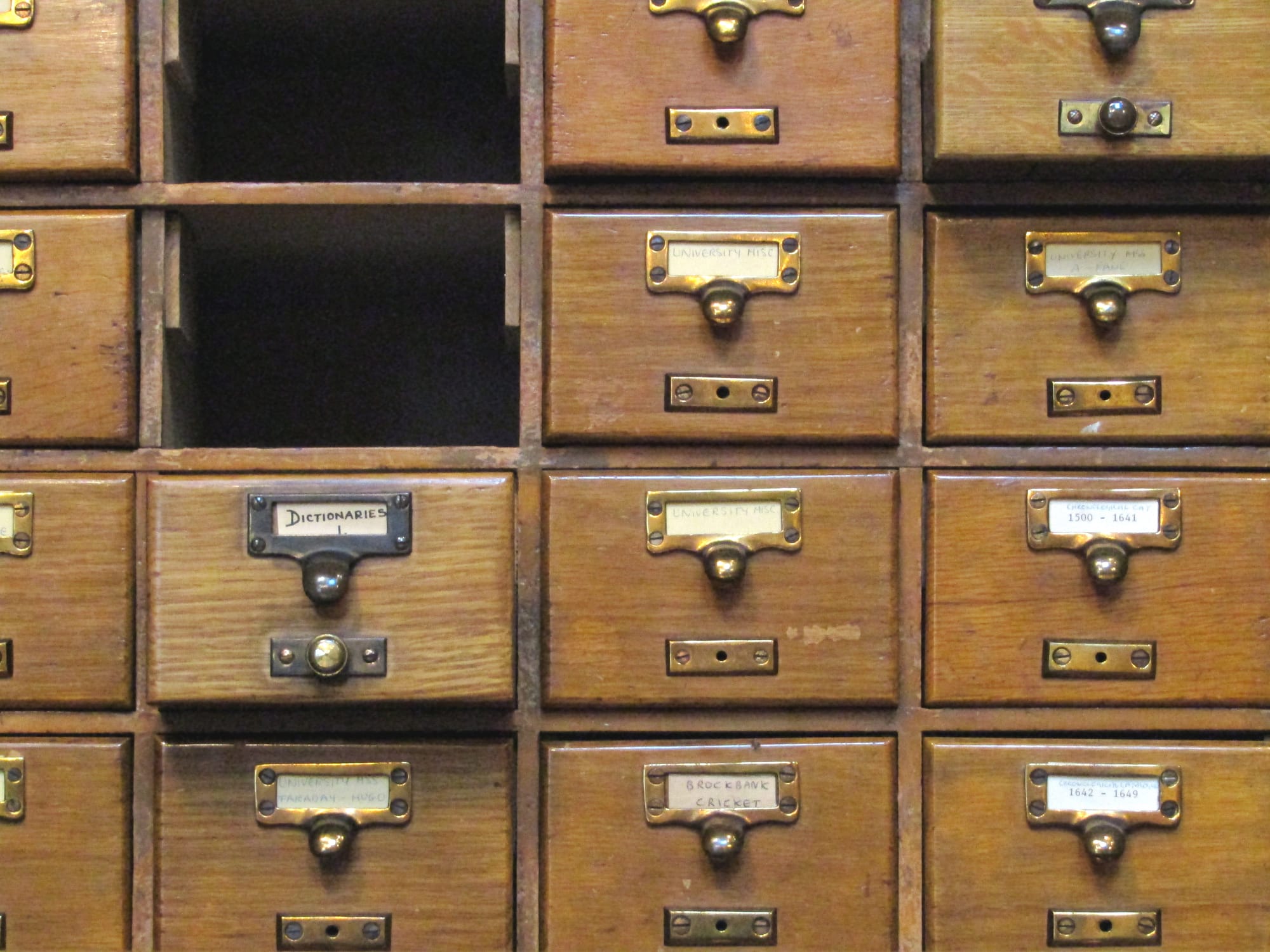 A library card catalog — drawers of index cards describing what the library holds and where