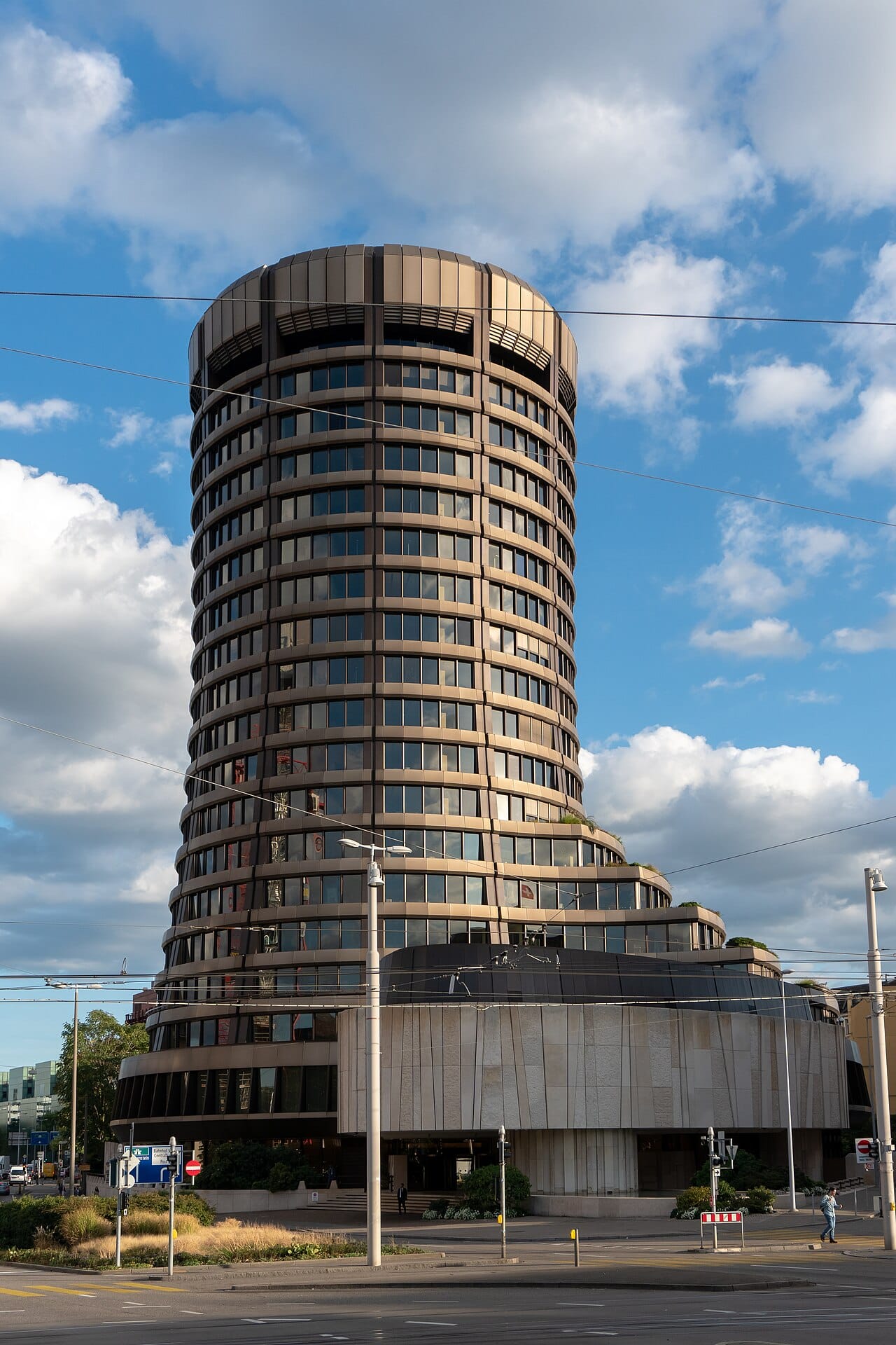 The round tower of the Bank for International Settlements in Basel against an evening sky